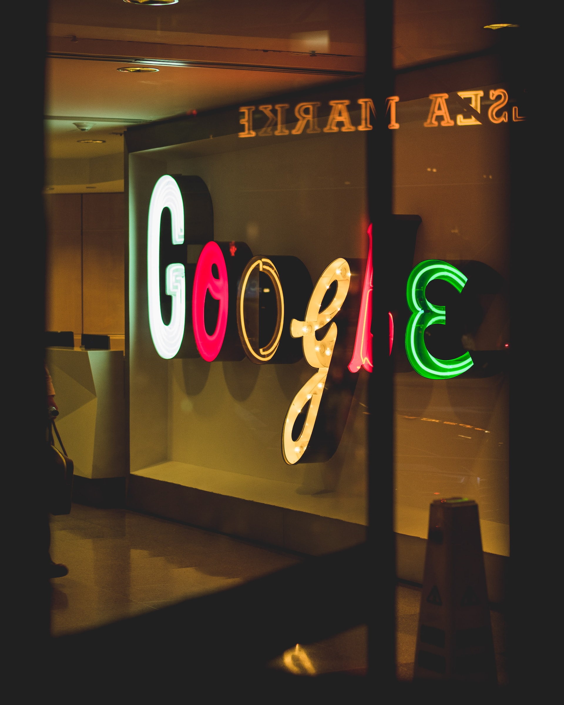 photo of a big LED google sign in a business - source: arthur-osipyan
